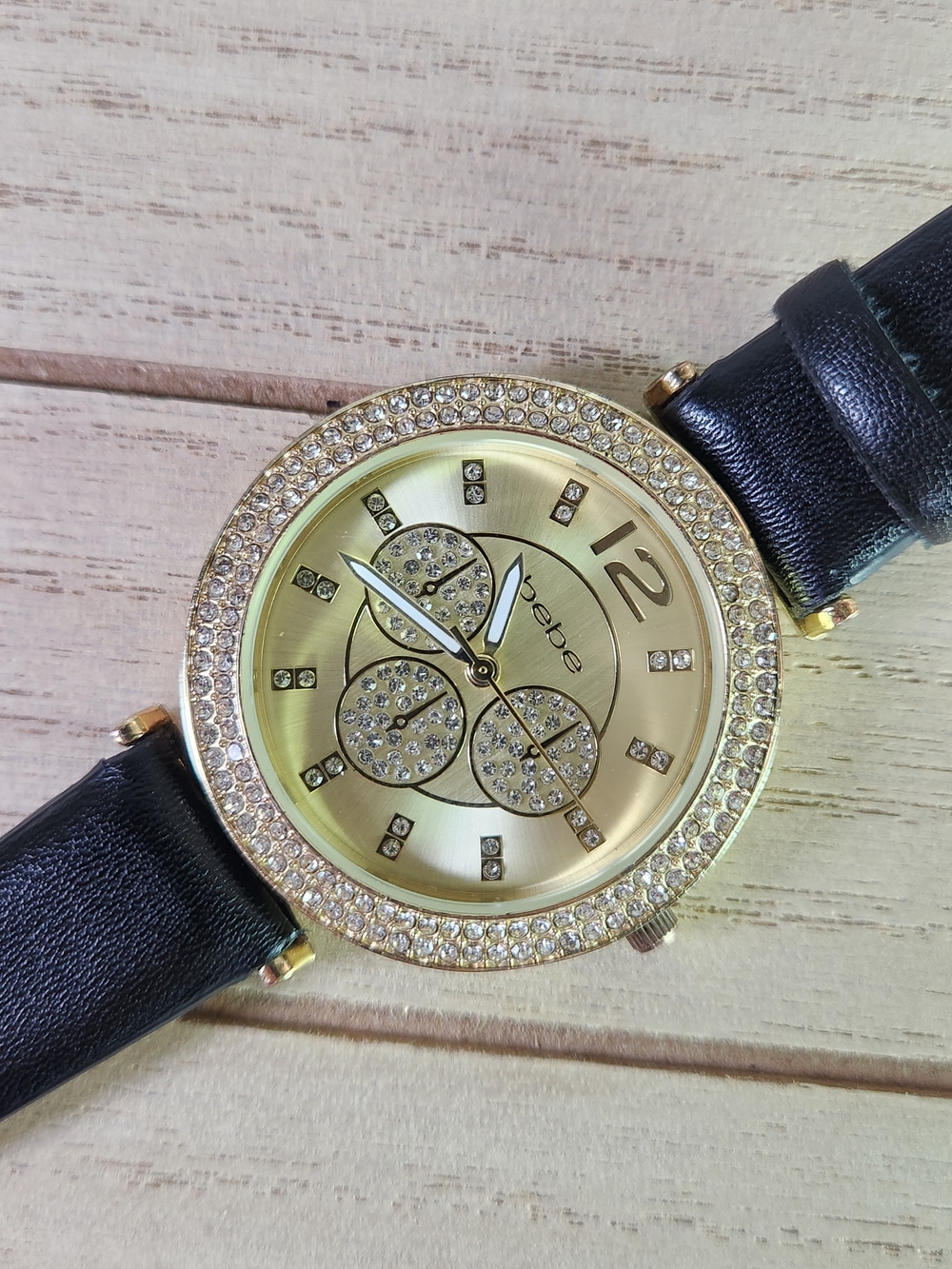 bebe Gold Tone Crystal Accent Watch with Black Strap